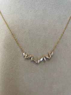 18 Karat Yellow Gold Necklace with 11 Straight Baguette Diamonds Luxury Yellow Gold Necklace With Baguette Diamonds, Luxury Dainty Necklace With Baguette Diamonds, Baguette Diamond Necklace, Baguette Diamond, Prong Setting, Diamond Necklace, Gold Necklace, Yellow Gold, Yellow