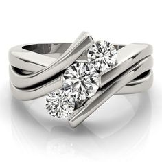 two stone engagement ring with twisted band and round brilliant cut diamond in the center, on a white background