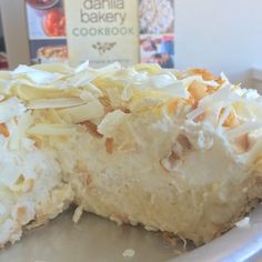 a close up of a pie on a plate with a box in the back ground