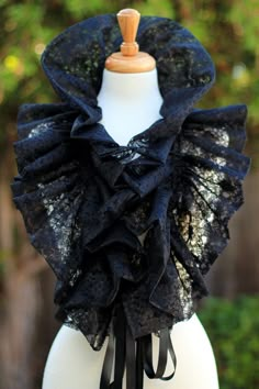 Add a little fantasy to your wardrobe with an avant garde ruffled fashion collar, in black vintage-inspired floral lace. It's gorgeous and mysterious over bare shoulders for evening, perfectly enchanting for a Victorian wedding, or a wonderful addition to a burlesque wardrobe. Makes a lovely neck ruff for an Elizabethan costume too. Double drawstring ties make it easy for you to create your own look with it on a whim. Wear it 5 different ways: *Wear it long and loose. *Tie the two ends together Black Lace For Spring Party, Black Lace Fashion, Steampunk Mode, Elizabethan Costume, Moda Steampunk, Couture Dior, Victorian Collar, Ruff Collar, Gothic Mode