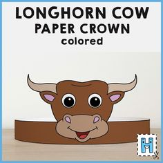 the longhorn cow paper crown is shown on a wooden surface with text that reads, longhorn cow paper crown colored