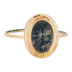 This is part of Chairish’s Fine Jewelry assortment.  Originally an antique Victorian era stick pin (circa 1880s to 1900s), the moss agate ring is crafted in 14 karat yellow gold.  The ring is mounted with the original stick pin. Our jeweler rounded the stick pin into a slim band for the finger. The beautifully detailed ring is set with moss agate measuring 9mm x 7mm. Moss agate is like looking into a small forest with small plumes formed within the stone suggestive of trees or plant life in natu Antique Rings Victorian, Small Forest, Moss Agate Jewelry, Vintage Cocktail Ring, Moss Agate Ring, Gold Cocktail Ring, Gold Cocktail, Victorian Rings, Detailed Ring