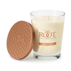 an image of a candle that is in front of a white background with the words root on it