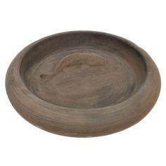 a wooden bowl with a fish on the bottom and a long tail sticking out of it