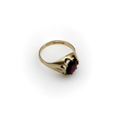 This is part of Chairish’s Fine Jewelry assortment.  This is a lovely 9K gold and rhodolite garnet ring. The ring is well marked—it contains the makers mark, the mark for London and the date letter for 1994. This ring was made by the Berker Brothers. The Berker Brothers is a family run business that specialises in wedding rings and was established in 1945. To this day, they remain one of the UK’s leading wedding ring manufacturers. This ring is a size 7 1/2, though it could be sized up or down. Rhodolite Garnet Ring, Garnet Ring, Rhodolite Garnet, Garnet Rings, The Ring, Makers Mark, Wedding Ring, Garnet, Fine Jewelry