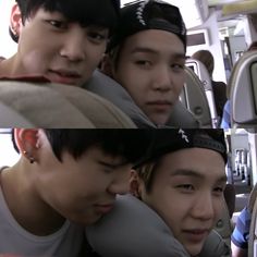 three young men sitting next to each other in front of a mirror on a bus