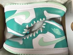 WMNS NIKE Air Jordan 1 Mid Washed Teal Mint Foam Shoes - WMNS Size 12 **CONFIRMED SHIPPED PRESALE** - Ships Immediately when received!! (Expected IN HAND by Wed. 7/27). Dressed in a Washed Teal, White, and Mint Foam color scheme. This offering of the Air Jordan 1 Mid comes constructed in a full leather build featuring a White base with Green overlays and a pastel shade of Green on the Swooshes, tongue tags, Wings, and rubber outsole. White nylon tongues, laces, and midsole completes the design. Teal Nike Air, Cute Air Jordans, Air Jordan 1 Custom, Teal Jordans, Jordan 1 Custom, Custom Air Jordan 1, Teal Nikes, Teal Shoes, Nike Air Jordan Shoes