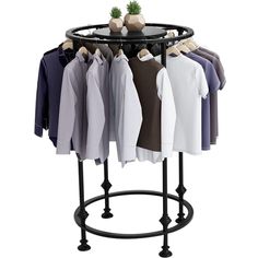 a rack with shirts and sweaters hanging from it's sides, on a white background