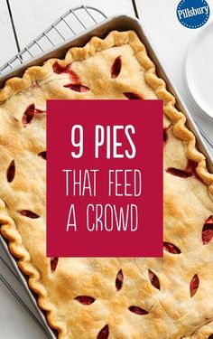 a pie sitting on top of a metal pan next to a white plate and fork