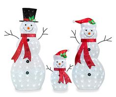 three lighted snowmen with hats and scarfs