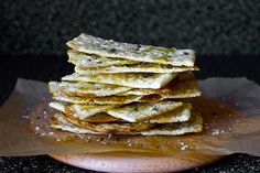 a stack of food sitting on top of a wooden cutting board