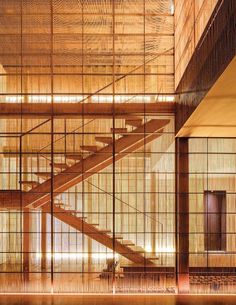 the inside of a building with wooden stairs