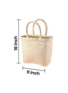 This tote bag with a hard, constructed design is made of raffia exterior, a material of natural origin imbued with a summery mood and lined with woven straw on the inside for added strength and stability. Natural lining on the top and bottom enhances the accessory. Keep your sunglasses, SPF, and essentials beach-ready stylishly stored in this sturdy boho tote. Ideal for Saturdays at the farmer’s market, seaside picnics, running errands, and many more. Gift this raffia tote bag to your fashionabl Eco-friendly Rectangular Natural Shoulder Bag, Rectangular Straw Bucket Bag For Market, Eco-friendly Shoulder Bag With Bamboo Handle, Natural Straw Bags With Fair Trade Details, Natural Straw Bags With Fair Trade, Rectangular Natural Straw Bag With Bamboo Handle, Rectangular Natural Bucket Bag For Market, Eco-friendly Beige Crochet Bag With Bamboo Handle, Eco-friendly Jute Bucket Bag With Bamboo Handle