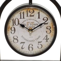 an old fashioned clock with numbers on the front and sides is displayed against a white background