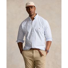 The oxford shirt made its debut very early on in Ralph Lauren’s designs and since then it has solidified its status as a pillar of the Polo look. Our fabric is developed with a secret wash that gives it instant character ease and a heathered softness. The formula is so unique it’s been kept in a safe for more than three decades. In addition to details that evoke its prep-school inspiration it offers a relaxed feel that produces what we call the perfect “rumple.” Today Mr. Lauren continues to cre Celebrity Men, Button Outfit, Prep School, School Inspiration, Oxford Shirt, Ralph Lauren Shirt, Mens Big And Tall, Big & Tall, Polo Ralph Lauren Mens