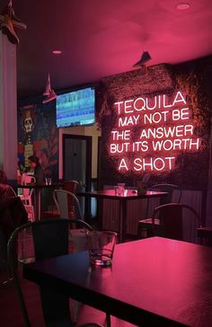 a neon sign that reads tequila may not be the answer, but it's worth a shot