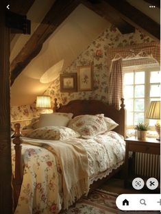 an image of a bedroom setting with flowers on the wall and bedding in it