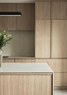 a vase filled with flowers sitting on top of a counter