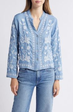 This lightweight chambray button-up shirt covered in intricate floral embroidery is the perfect layering piece all year 'round. Front button closure V-neck Long sleeves 100% cotton Hand wash, dry flat Made in the USA Spring Bohemian Button-up Tops, Embroidered Relaxed Fit Shirt For Spring, Light Wash Tops With Button Closure For Spring, Spring Floral Embroidery Relaxed Fit Shirt, Light Indigo Long Sleeve Shirt For Spring, Spring Bohemian Button-up Shirt, Spring Bohemian Shirt With Button Closure, Bohemian Spring Shirt With Button Closure, Bohemian Shirt With Button Closure For Spring