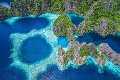 an aerial view of the blue lagoons and surrounding islands