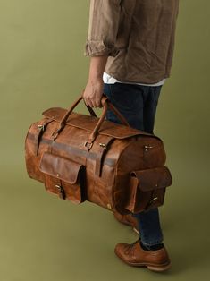 GUARANTEED CHRISTMAS DELIVERY ON ORDERS PLACED BEFORE THE 19TH OF DEC. Smart Carry on Travel Bags For Men | Monogrammed Gift For Husband | Personalized Leather Duffle Bag For Men | Monogrammed Genuine Leather Weekender Bag For Him | Leather Holdall For Travels| Overnight Travel Bag For Men | Leather Backpack and Duffle Collection | Christmas Gifts For Him | cyber2023 Combining traditional rustic elegance with rugged practicality our leather weekender bag is designed with plenty of room to hold everything you'll need for stylish weekend, week-long adventures, extended stay or just a simple overnight bag. The Davies Leather Travel Duffle Bag is constructed from thick, durable water buffalo hide, reliable YKK zipper and anti rust brass fittings. The main compartment which can pack for 4 days Luxury Brown Duffle Bag For Overnight Trips, Luxury Men's Shoulder Bag With Luggage Sleeve, Luxury Functional Men's Duffle Bag, Luxury Men's Weekender Bag For Business Trips, Leather Pouch Bag With Pockets, Brown Bags With Leather Lining For Trip, Brown Duffle Bag Satchel With Pockets, Brown Satchel Duffle Bag With Pockets, Leather Duffle Bag With Pockets