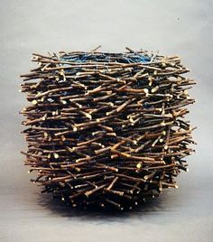 a ball made out of sticks and nails