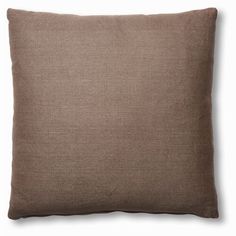 a brown pillow on a white background