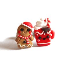 two miniature gingerbreads are sitting next to each other