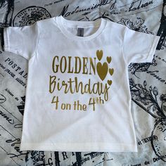 Golden Birthday Shirt!  If you would like a name and age on the back, please see the listing below :) https://www.etsy.com/listing/623139218/golden-birthday-shirt-any-age Please see the pictures for sizing, as well as for vinyl colors.  Please note, Newborn sizes only come in white. In the notes section, please include: 1. Vinyl/Writing color(s) preferred 2. Age for the shirt 3. Date needed by **Free Standard Shipping. If you need your item sooner, please choose Priority Shipping during checkout Gold Top With Graphic Print For Birthday, Gold Graphic Print Top For Birthday, Gold Top With Graphic Print, Gold Letter Print T-shirt For Birthday, Gold T-shirt With Letter Print For Birthday, Gold Crew Neck Top As Gift, Gold Letter Print T-shirt For Party, Gold Tops With Letter Print For Gifts, Gold Short Sleeve Top As Gift