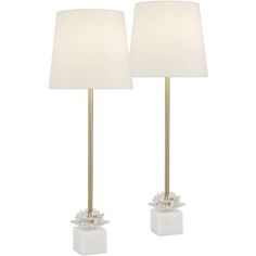 two lamps with white shades on them