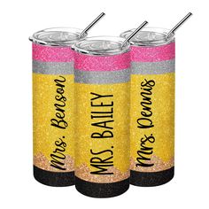 three personalized glitter can coolers with straw tops