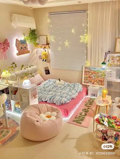 a bedroom decorated in pastel colors with toys on the floor and decorations around it