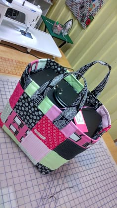 a handbag sitting on top of a cutting mat