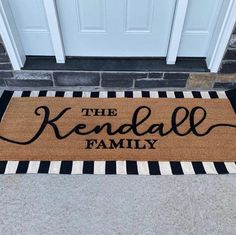 a door mat that says the kendal family on it in black and white stripes