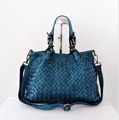 "Soft Teal Blue Woven Italian Leather Tote Bag, Italain Slouchy Bag, Slouchy Bag, Customizable, Handmade Woven Leather Handbag, Elow, comes in two versions: LARGE: W 15\" x H 11.4\" x D 7.1\" & SMALL: W 13\" x H 10\" x D 6\". Handle drop: 4\" The bag has made in distressed soft cowhide and distressed brass hardware We offer a free customization for monogramming Inside: Two compartments inside with central divider/ zippered pocket Interior fully lined with cotton fabric One zippered pocket One iP Artisan Blue Leather Shoulder Bag, Blue Textured Leather Shoulder Bag For Shopping, Blue Leather Artisan Shoulder Bag, Blue Textured Leather Bag With Double Handle, Blue Bags With Leather Handles For On-the-go, Slouchy Bag, Italian Leather Bags, Purse Handmade, Meaningful Drawings