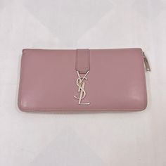 Brand: Yves Saint Laurent Color: Pink Material: Leather Inclusions: / Dimensions: W18.5cm X H10cm X D2.5cm Serial Number: Na Country Of Origin: Italy Condition: B - Good Condition. Accessory: Box, Paper And Bag, Introducing The Saint Laurent Wallet In A Beautiful Pink Color. This Wallet Is Crafted With High-Quality Leather, Known For Its Durability And Luxurious Feel. Condition: B (Good Condition But Signs Of Small Scratches And / Or Stains) Before Purchasing, Please Refer To The Images For The Exact Condition Of The Item. All Sales Are Final. No Return Accepted. Thank You! Yves Saint Laurent Bags, Box Paper, Saint Laurent Wallet, The Saint, Long Wallet, Pink Leather, High Quality Leather, Pink Color, Yves Saint Laurent