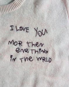 someone wrote this message on their t - shirt that says i love you more than everything in the world