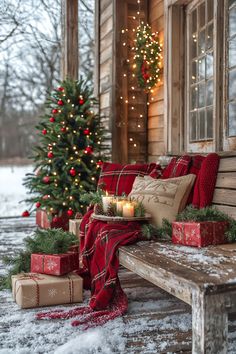 a christmas tree and presents on a porch