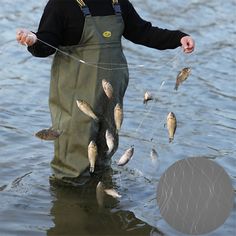 a man standing in the water while holding onto some fish and catching them with his hands