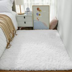 a white rug on the floor in a bedroom