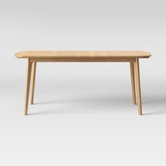 a wooden table with two legs and a long, narrow top on an isolated white background