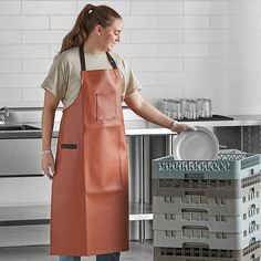 Stay dry and protect clothes with this Choice 40" x 26" light brown 38 mil heavy weight vinyl adjustable dishwasher apron! The 38 mil, heavy weight vinyl construction ensures this apron is durable enough to withstand all dishwashing messes, and it is easy to simply wipe clean when necessary so that it's ready to use whenever you need it. Plus, it features a cotton knit backing and a soft neck pad to maintain comfort during long shifts.   The neck strap is adjustable for a customizable fit, makin Restaurant Aprons, Pvc Apron, Workwear Vintage, Dirty Dishes, Half Apron, Cleaning Dishes, Protective Clothing, Apron Pockets, Neck Strap