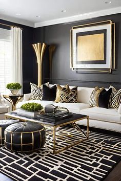 a black and white living room with gold accents