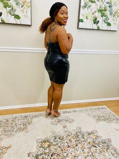 This dress is sure to bring all the drama to your weekend wardrobe doll. Featuring a black faux leather material with a lace-up design and an underwire support. Style with clear heels and gold hoop earrings for a look that is sure to have heads turning. 55% PU 45% Polyester - Has great stretch Nidy is 174 pounds, 5'2" and wear a medium Size: Small is 4-6, Medium 8-10, Large 10-12 Trendy Faux Leather Dress For Party, Trendy Faux Leather Party Dress, Edgy Faux Leather Dress For Night Out, Trendy Black Faux Leather Dress, Black Faux Leather Mini Dress, Edgy Style, Black Faux Leather Edgy Mini Dress, Edgy Black Faux Leather Mini Dress, Edgy Leather Mini Dress For Night Out, Black Leather Mini Dress For Night Out