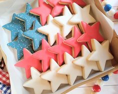 decorated cookies in the shape of stars on a table