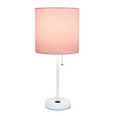 a white table lamp with a pink shade on the base and a light bulb attached to it