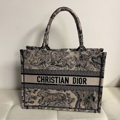 Shop With Confidence! We Only Sell Authentic!!! Brand: Christian Dior Made In Italy Style/Size/Color: Tote Bag/ Approx. 14" W X 10.50" H X 4.5" Dx Handle Drop: 6.5"/Navy Blue Christian Dior Canvas Embroidered Dioriviera Toile De Jouy Book Tote Bag Blue And Ecru Toile De Jouy Reverse Embroidery Introduced By Maria Grazia Chiuri, Creative Director Of Christian Dior, The Dior Book Tote Has Become A Staple Of The Dior Aesthetic. Designed To Hold All The Daily Essentials, The Style Is Fully Embroidered With A Blue And Ecru Toile De Jouy Reverse Motif, A Variation Of The House's Hallmark Pattern With A Play On Reversed Colors. Adorned With The Christian Dior Paris Signatur Designer Embroidered Shopping Bag, Designer Embroidered Tote Bag, Designer Embroidered Bags For Shopping, Designer Embroidered Bags For Daily Use, Luxury Embroidered Travel Bags, Reverse Embroidery, Dior Aesthetic, Dior Book, Christian Dior Paris