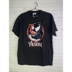 Up For Grabs Is A Brand New Marvel Comics Venom Short Sleeve Logo Graphic Tee T-Shirt Black Red Men's Size Large. Never Worn Or Used. Measurements Laying Flat Are Included In Photos. Please Refer To All Photos. Ask Any Questions Prior To Purchasing. Thanks! Crew Neck T-shirt For Comic-con Streetwear, Black T-shirt With Graphic Print For Comic-con, Black Pop Culture T-shirt For Comic-con, Black T-shirt For Halloween And Fan Conventions, Black T-shirt For Comic-con, Comic-con Graphic Cotton T-shirt, Casual T-shirt For Comic-con, Cotton Top For Comic-con Fan Merchandise, Cotton Tops For Comic-con Fan Merchandise