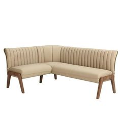 a beige leather sectional sofa with wooden legs and backrests on an isolated white background