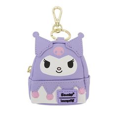 a purple and white purse shaped keychain with an animal face on the front